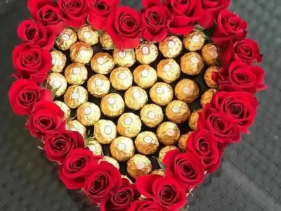 Italian ferrero rochers and locally grown roses in heartshape box - The Flowers Pakistan