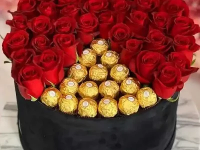 Imported Red Roses and original Italian Ferrero Rochers in round hatbox - theflowers.pk