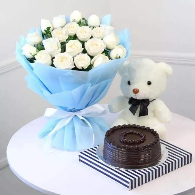 10 White roses Half Kg Blackforest cake with a heart 6 inch teddy - Best Florist in Pakistan
